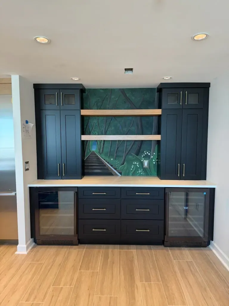 Navy wet bar with shaker cabinets and a stone counter